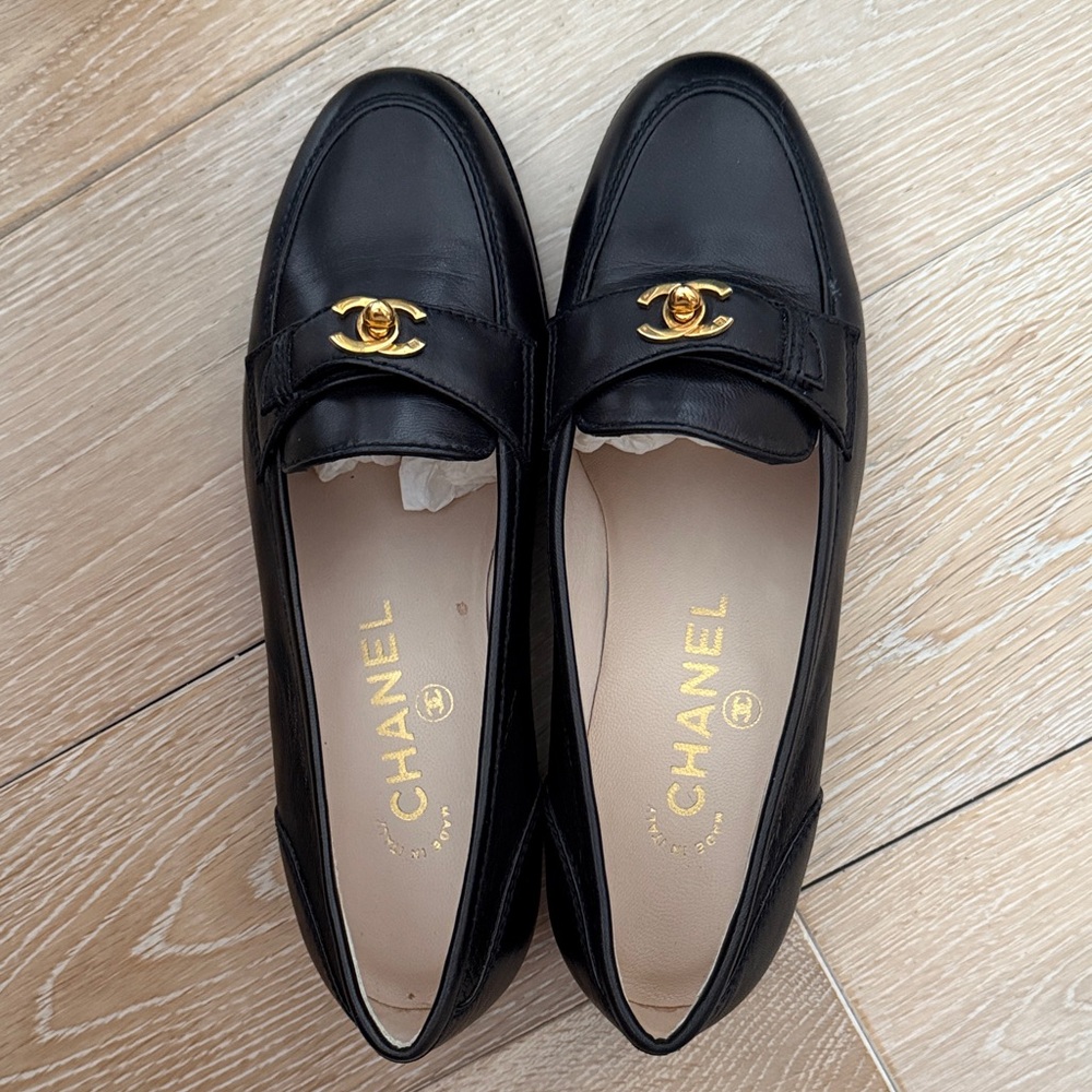CHANEL Black Flats with Gold Logo